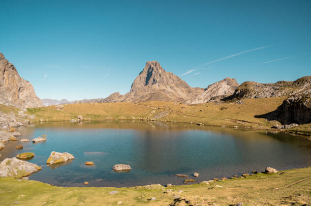 istock lake reflection in the mountain peak trees 1990287935