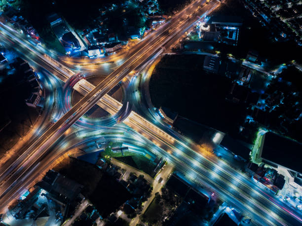 istock Expressway top view, Road traffic an important infrastructure, Drone aerial view fly in circle, traffic transportation, Public transport or commuter city life concept of economic and energ, transport. 1990293776