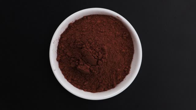 cacao powder top view on black