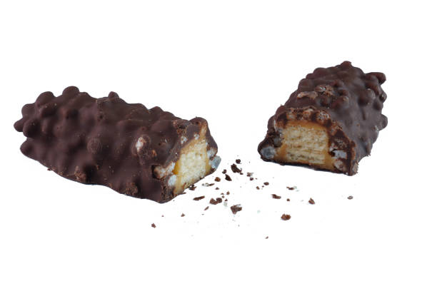istock Chocolate bar stuffed with rice puff, crispy wafer and caramel isolated on white background 1990372298