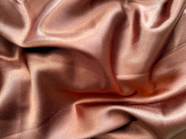 istock A close-up of brown satin as a background 1990378116