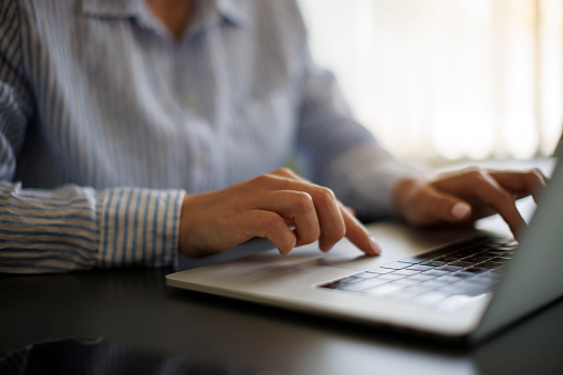 Woman using laptop computer