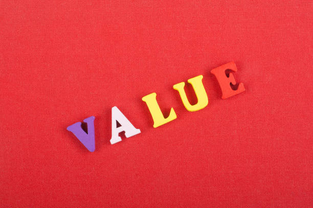 istock VALUE word on red background composed from colorful abc alphabet block wooden letters, copy space for ad text. Learning english concept. 1990409277