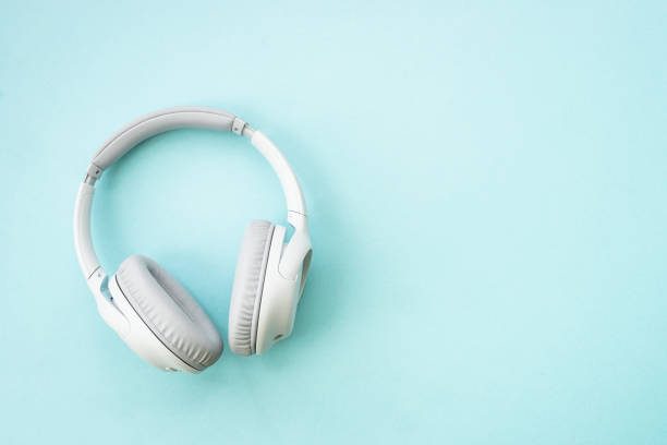 istock Wireless Headphones on blue background. 1990419101