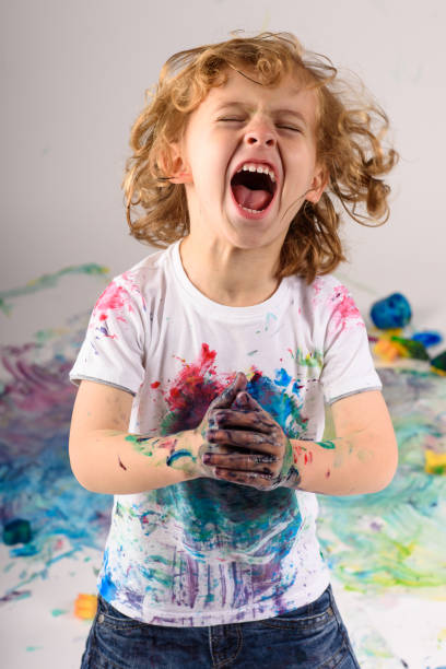 istock Excited dirty boy screaming in studio 1990447102