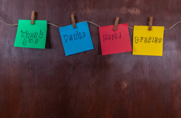 istock Thank you on sticky notes hanging on string with clothes pins on wood background with copy space 1990466523