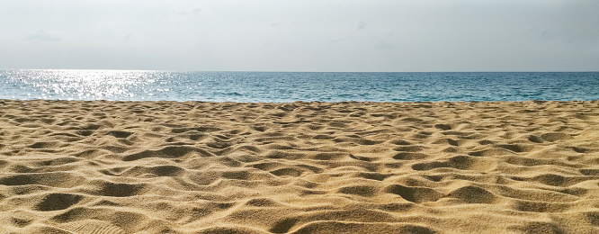 Sand and blue sea background