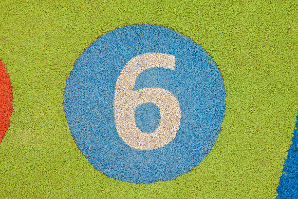 Number 6 And Straight Pin On Blue Background
