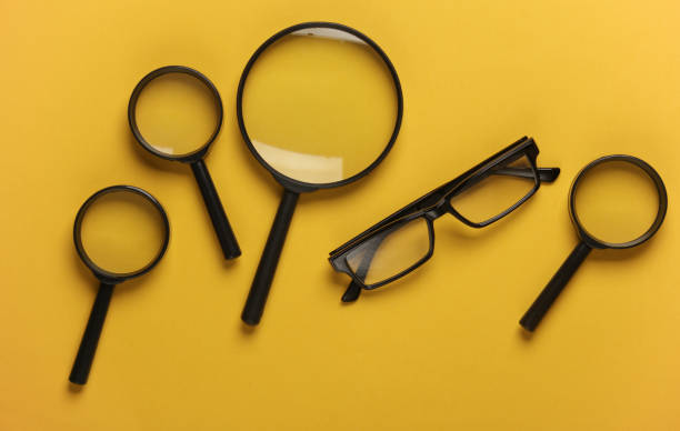 istock Magnifiers and eyeglasses on yellow background 1990515078