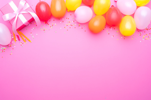 Birthday party on pink background. Copy space