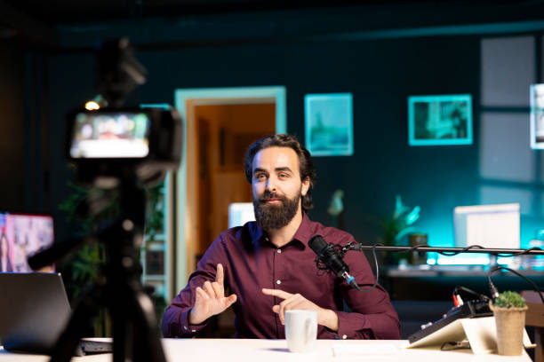 istock Vlogger presenting informations during streaming service broadcast filmed high tech gear 1990558429