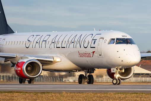 Graz, Austria - December 29, 2023: Embraer 195 of Austrian Airlines in Star Alliance livery lining up the runway in Graz Thalerhof