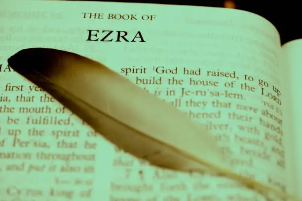 The Holybible book of The book of ezra Index for background and inspiration with the feather