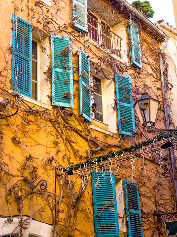 Close up window with shutter from old house in St Tropez, France