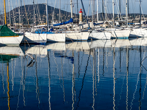 Yachts, sailing boats and pleasure boats are moored in marina of Balchik city in black sea coast at Bulgaria.