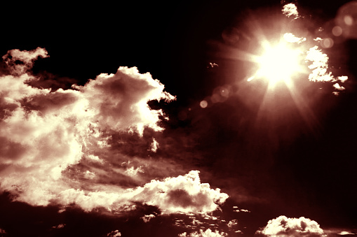 Dramatic sky with shinning sun background