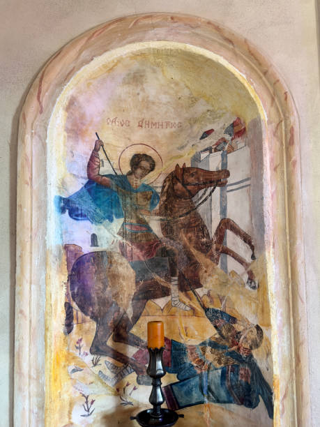 istock Historic chapel interior wall with iconographic paintings 1990638832