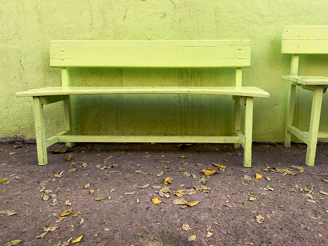 Wooden bench at storefront