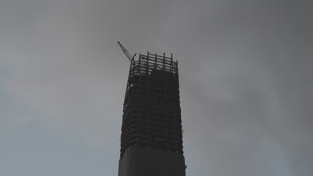 Building under construction with sky in the background