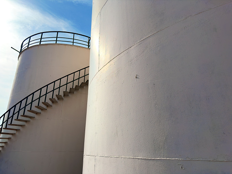 Close up industrial outdoor storage tanks