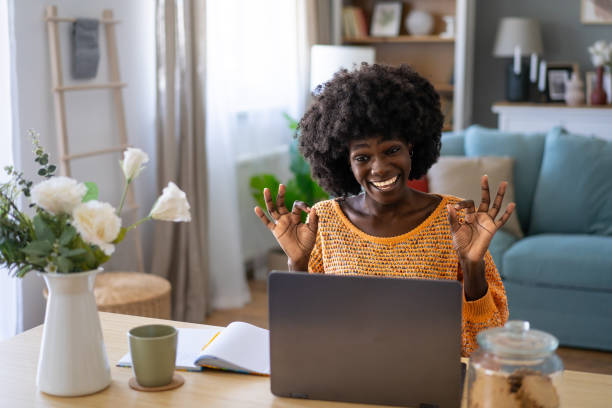 istock Young woman making OK sign with her hands 1990702493