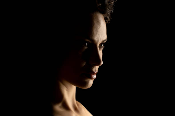 istock Sensual Profile Silhouette Portrait on Dark Background 1990740937