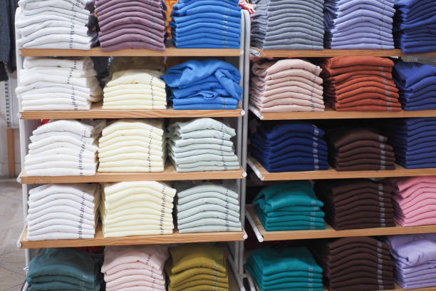 istock Colorful Shirts on shelf in a retail shop 1990743006