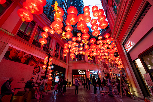 Hong Kong - February 6, 2024 : People walk under red lanterns hanged from the ceiling at Lee Tung Avenue in Hong Kong to celebrate the Chinese New Year festival and the Year of the Dragon.