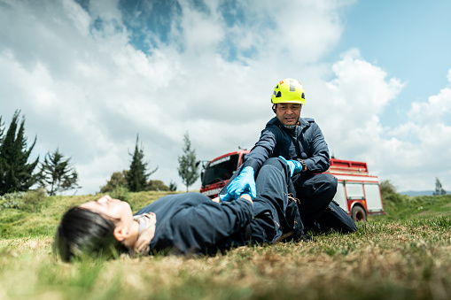 Paramedic helping an accident victim