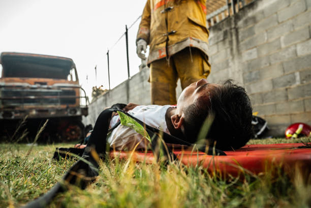 istock Teenage boy lying on a stretcher after a accident 1990758177