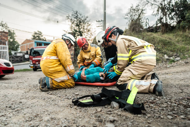 istock Firefighters helping a car accident victim 1990758691