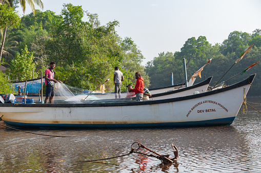 Agonda, Goa, India, 20th of december 2023, Fisherman fishing on the river of Agonda.