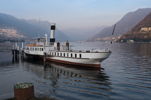 Como, Italy - 2023, February 17 : A retired passenger boat called Patria at the harbor of Como in northern Italy