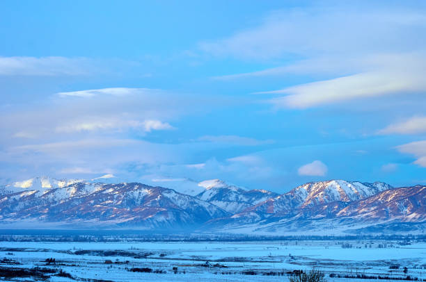 istock Cold snowy mountain landscape at sunset. 1990782013