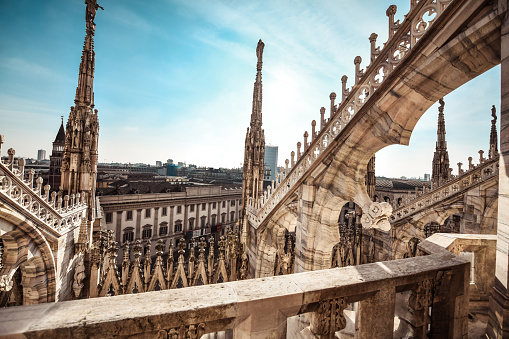 Terraces Of Rooftop, Statues On Towers Of Duomo And Palazzo Reale In Milan, Italy