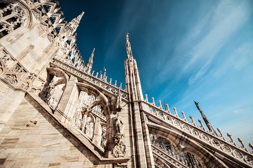 Low Angle View Of Duomo Pillars, Towers And Statues In Milano, Italy