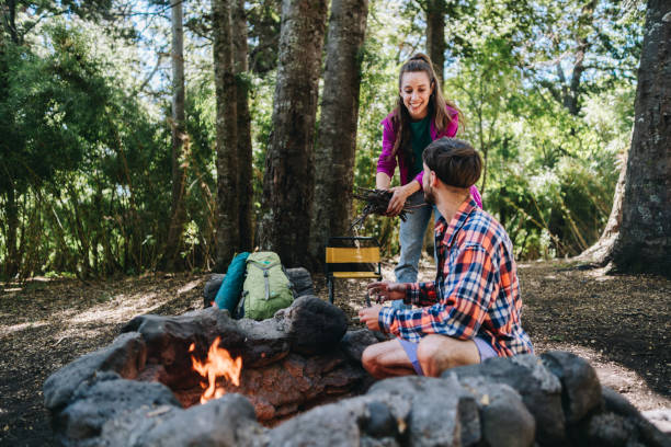 istock Friends doing a bonfire at a camp in the forest 1990824792