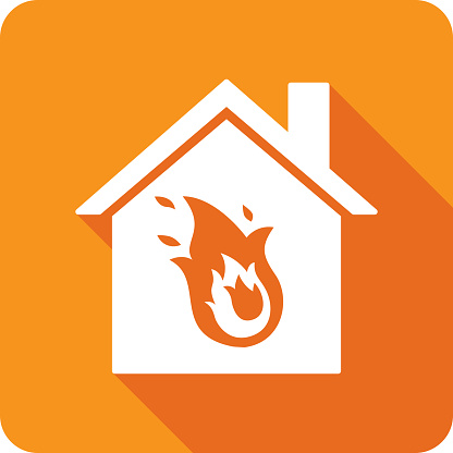 Vector illustration of a house with fire icon against an orange background in flat style.