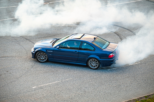 Lindesnes, Norway - October 15 2011: Blue BMW M3 E46 doing a burnout.