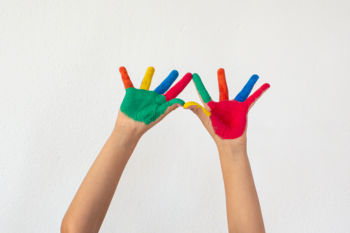 Boy Showing Colorful Paint on His Hands.