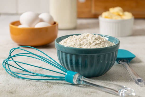 istock Ingredients to prepare cake. Wheat flour, eggs, butter and milk. 1990975151
