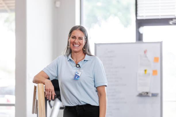 Mature female physical therapist smiles for the camera