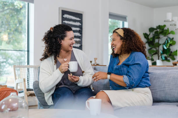 istock Two female friends enjoy laughing together 1991035872