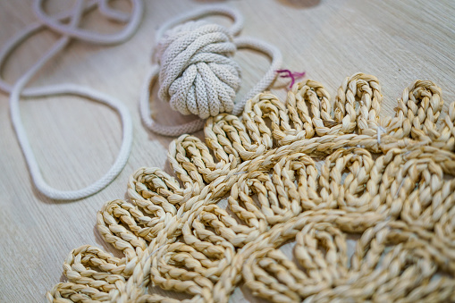 Making colorful hanging wall tapestry. Handmade workshop.