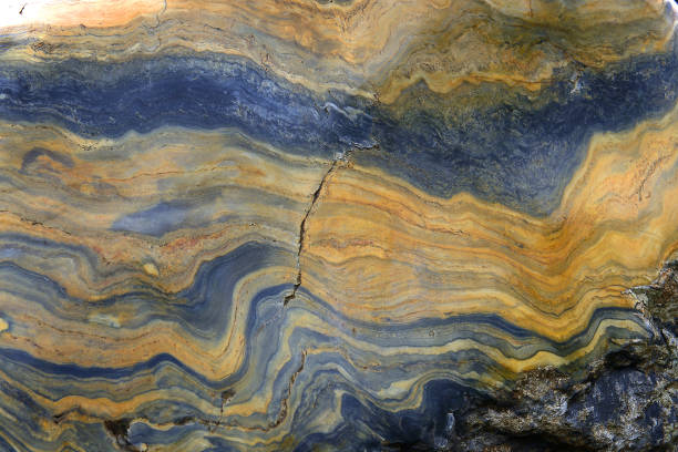istock Colored layers of stone as a background 1991099617