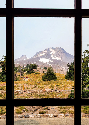 View of Mount Hood from Timberline Lodge in late summer, made hazier by wildfire smoke.
