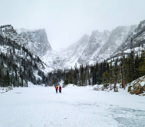istock Winter hikers on a frozen alpine lake 1991101734