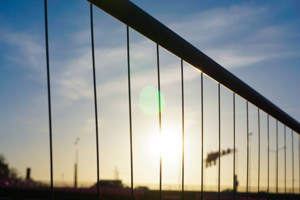 Low angle view of a fence against the sky