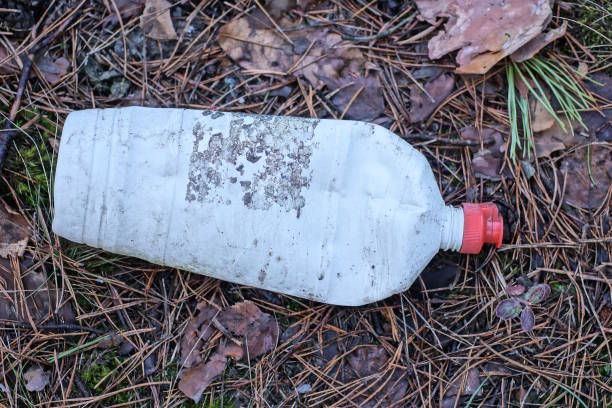 istock garbage from one white plastic bottle lies on the gray earth 1991161537