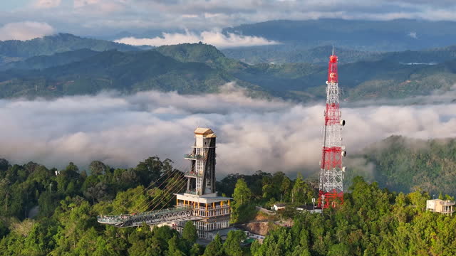 Aerial Drone View of Sea of fog in the morning, Longest skywalk in Asia, Aiyerweng, Betong city, Yala Province, Thailand
